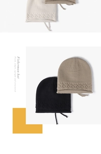 Detailed view of the diamond knit texture and long chin straps on these minimalist beanies