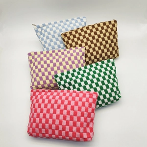 Large checkered knit cosmetic bags in various colors with zipper closures for travel
