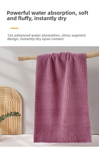 Close-up of thick purple coral fleece towel with waffle texture and wave edges