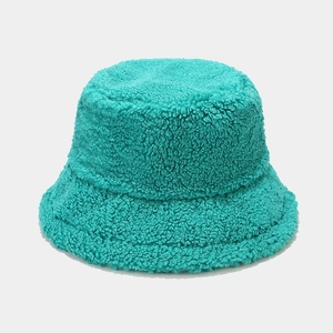 Close-up of turquoise thick lamb wool bucket hat showing warm fleece texture and soft fabric