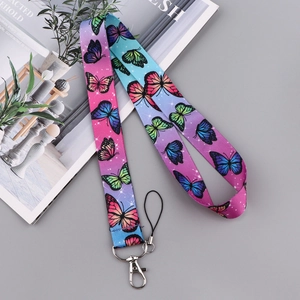 Detail of colorful butterfly lanyard with metal clasp on a lifestyle background