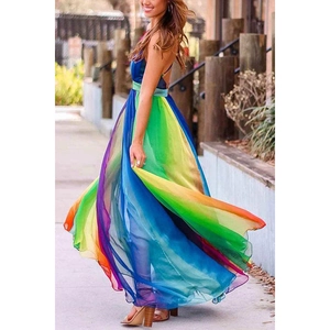 Close-up of rainbow gradient chiffon dress showing flowing movement and deep V neckline