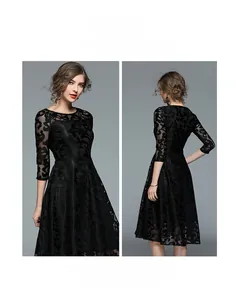 Detail view showing black lace midi dress with mesh sleeves and slim-fit waist design