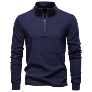 Front view of navy blue half-zip sweatshirt with stand collar and brushed soft texture
