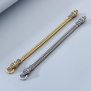 Detail of snake head clasp and scale chain in 18K gold and silver stainless steel
