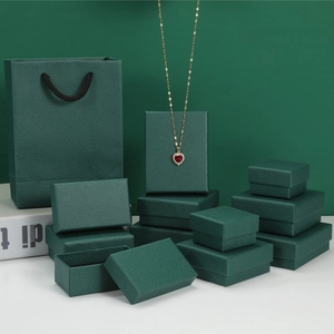 Dark green jewelry box set with litchi texture and matching gift bag for jewelry