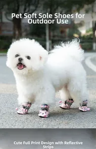 Detail of pink dog shoes featuring reflective strips and a non-slip soft rubber sole