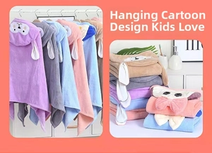 Detail of hooded kids bathrobe featuring animal ears and thick absorbent coral fleece
