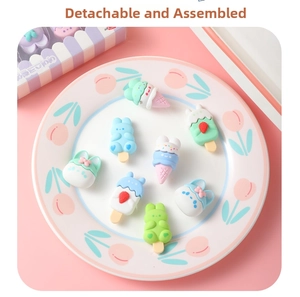 Detailed view of removable cartoon rabbit and dessert shaped erasers in macaron colors