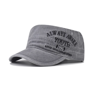 Close-up of washed gray cadet cap featuring high-quality embroidery and metal eyelets