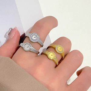 Adjustable watch-shaped ring set in gold and silver finish with band-like texture