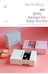 Detail showing elegant drawer-style jewelry boxes in blue, pink, and beige with soft lining