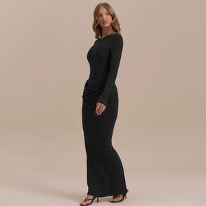 Detailed side view of the pleated waist design on this slim fit black maxi dress