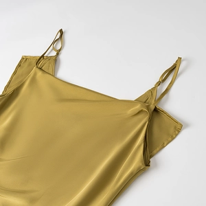 Olive gold satin slip dress with side slit and elegant silk texture shown in flat lay view