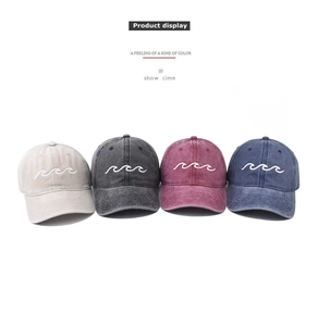 Detailed display of four colors of washed cotton baseball caps with wave embroidery