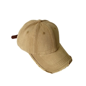 Distressed khaki washed cotton baseball cap with a vintage frayed brim and classic six-panel design