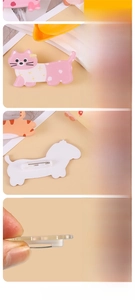 Macro detail of acrylic dachshund brooch showing digital printing and safety pin back