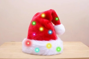 Detail of red plush Christmas hat featuring festive glowing multicolored LED lights