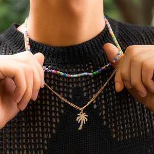 Men's colorful bead necklace set with a gold coconut tree pendant and sparkling crystals
