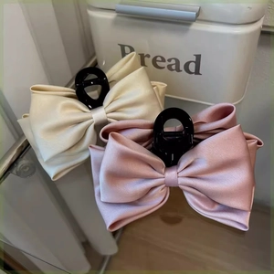 Large double-sided satin bow hair claw clips in cream white and soft pink