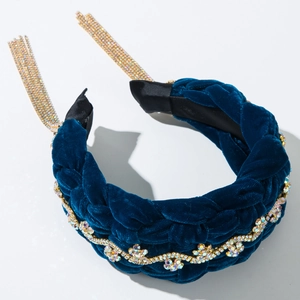 Detail of blue velvet braided headband featuring sparkling rhinestone chain and tassel