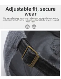 Detailed view of adjustable antique bronze metal buckle on vintage washed baseball cap