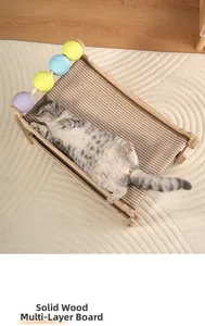 Close-up of a cat resting on a solid wood multi-layer frame with sisal scratching balls