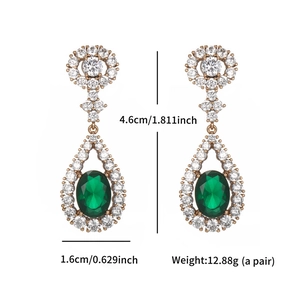 Detail view of emerald green teardrop earrings with dimensions 4.6cm by 1.6cm