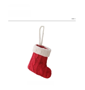 Close-up of red and white cable knit mini Christmas stocking cutlery holder details