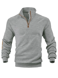 Detailansicht der grauen Waffelstrick-Struktur des Herren-Sweatshirts mit Halbreißverschluss