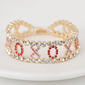 Chic XOXO hollow gold bracelet with red pink and white crystals for women