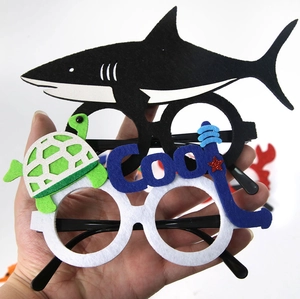 Detail of felt ocean theme party glasses featuring shark turtle and COOL letter designs