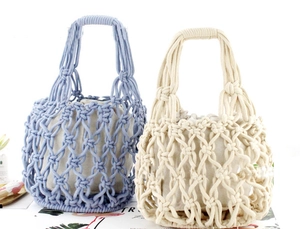 Detail of blue and beige handmade cotton rope woven beach bags with canvas lining