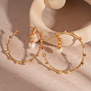 Golden bamboo hoop earrings with colorful stones and white pearl drops for women