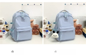 Close-up of blue water-resistant nylon backpack detail with panda plush charm accessory