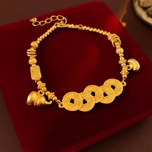 Golden bracelet with gourd and lucky coin pendants on a premium red velvet background