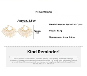 Detail view of 18k gold plated star hoop earrings with white crystal cluster ornaments