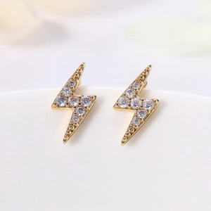 Minimalist gold lightning bolt stud earrings with sparkling white cubic zirconia