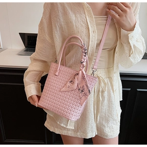 Pink woven bucket bag for women with decorative silk scarf and dual top handles