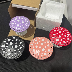 Four-piece colorful resin mushroom earring display stand set with protective packaging