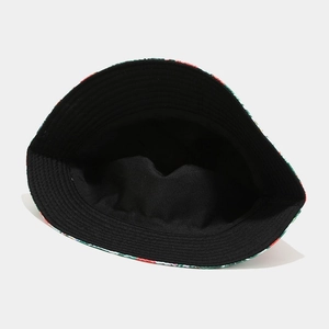 Detail of flamingo pattern brim and black cotton interior of the foldable sun hat