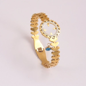 Golden heart-link bracelet featuring an openwork circular pattern and blue Evil Eye charm