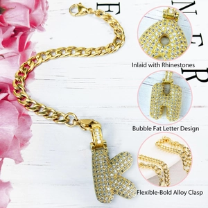 Golden hip hop bubble letter K charm with sparkling rhinestones on a chunky chain strap