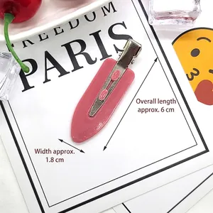 Close-up of a 6cm pink leaf resin hair clip with silver metal duckbill base