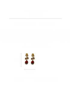 Detailed view of vintage hollow metal earrings with red gemstones and rhinestones