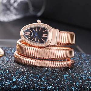 Detail of rose gold snake-shaped watch with crystal bezel and black teardrop dial