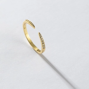 Macro shot of gold-plated S925 sterling silver open ring with micro-pave zircon stones