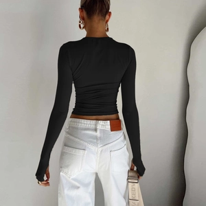 Slim fit black long sleeve top with thumbholes and round neck in high elastic fabric