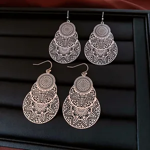 Hollow leaf flower earrings in silver and rose gold layered metal design