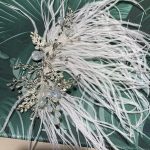 Bridal hair accessory with white feathers, alloy leaves, crystals, and opal beads decor